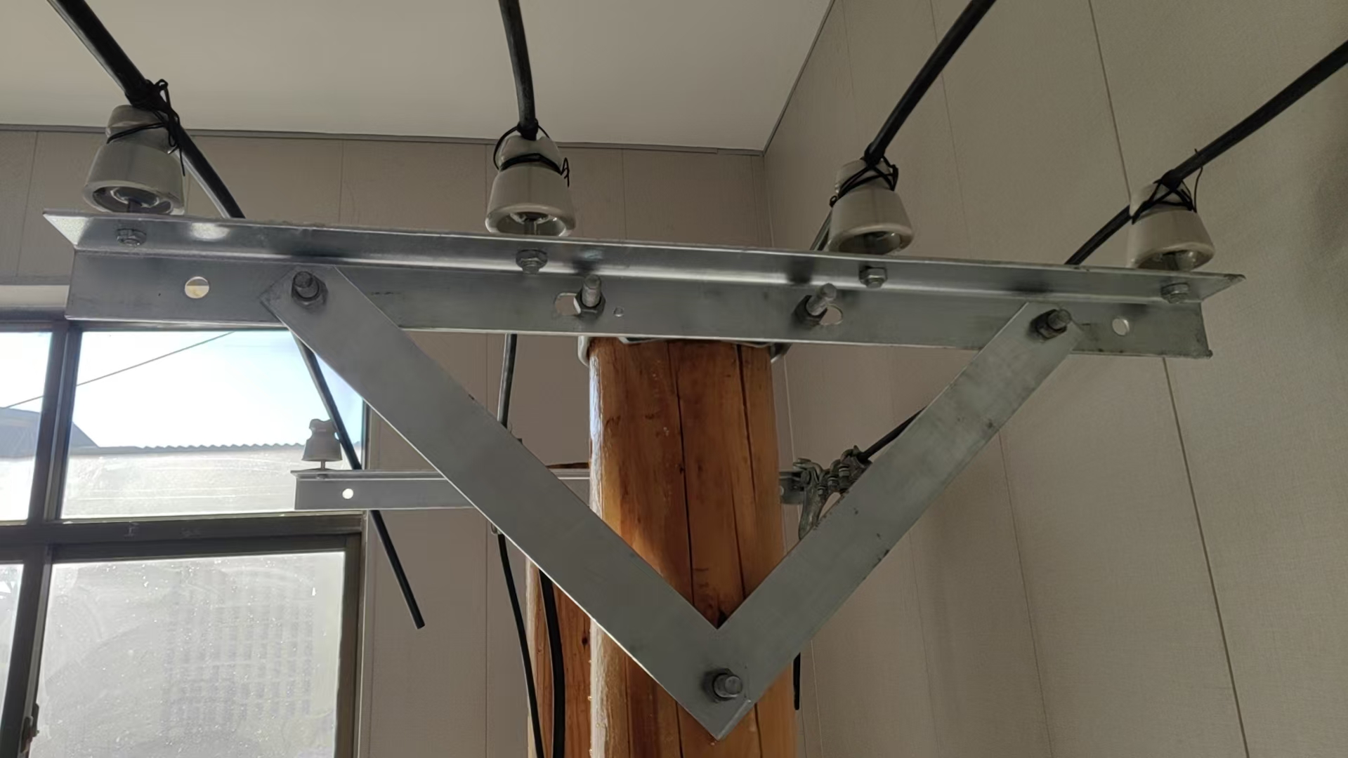 What is the role of crossarms in a power system?